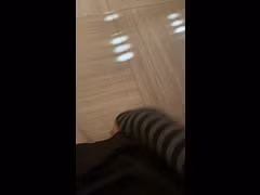 A trans femboy man masturbates with a dildo and moans.