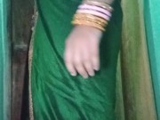 Indian gay Crossdresser Gaurisissy in Green Saree pressing her big Boobs and fingering in her ass
