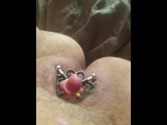 Trying to secure a nipple clamp around my pumped clit