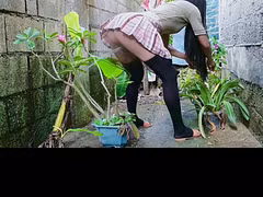 Pissing from behind while I was trimming dried leaves in plants